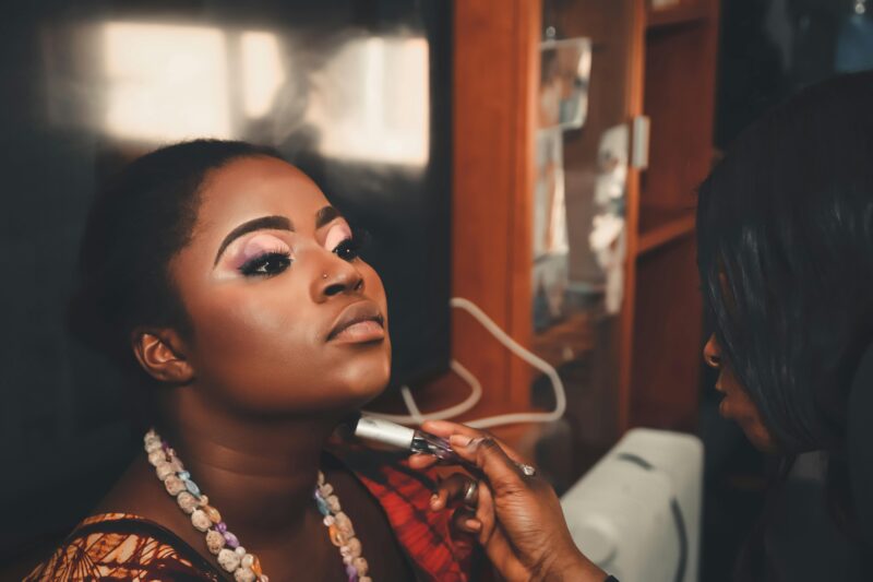 Young African woman working on side hustles like freelancing, personal shopping, and hairdressing to grow her income.