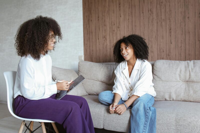 Black woman in therapy prioritising her mental health