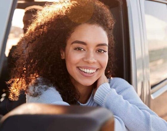 A woman pausing in quiet reflection, symbolizing finding God in everyday moments