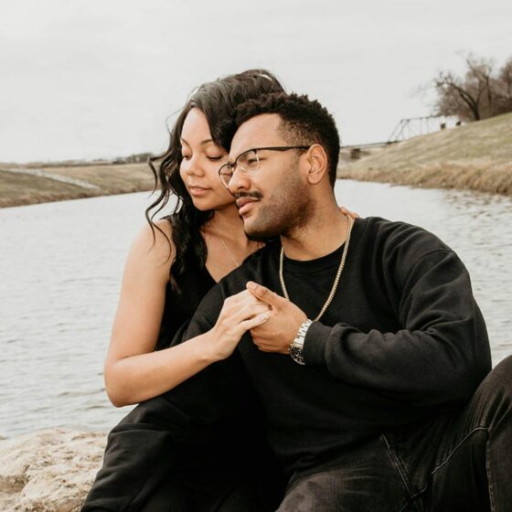 A couple sitting together representing the choice between marrying for money or love.