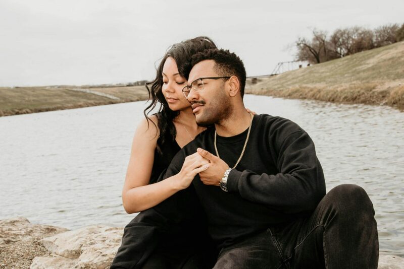 A couple sitting together representing the choice between marrying for money or love.
