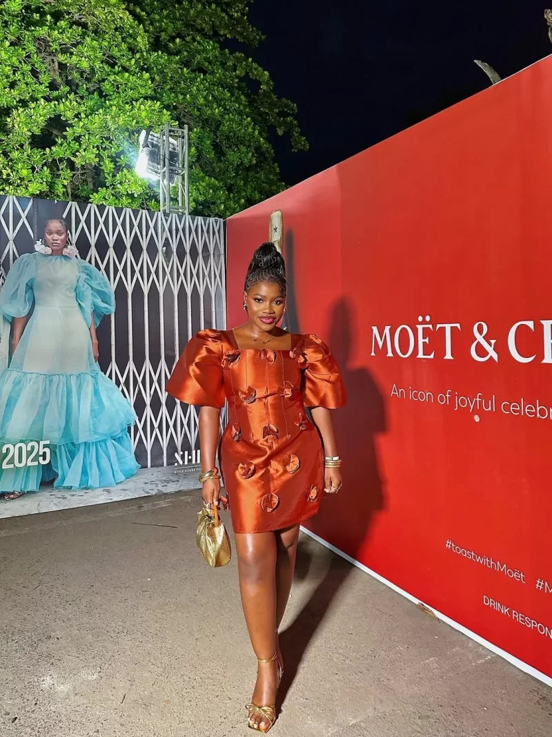 Oluwaseunayooo at Lagos Fashion Week 2025 showcasing elegant street style looks