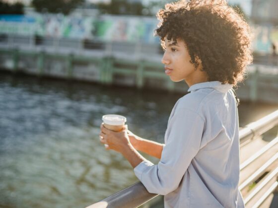 A confident woman walking outdoors, representing pretty privilege meaning and society’s beauty expectations
