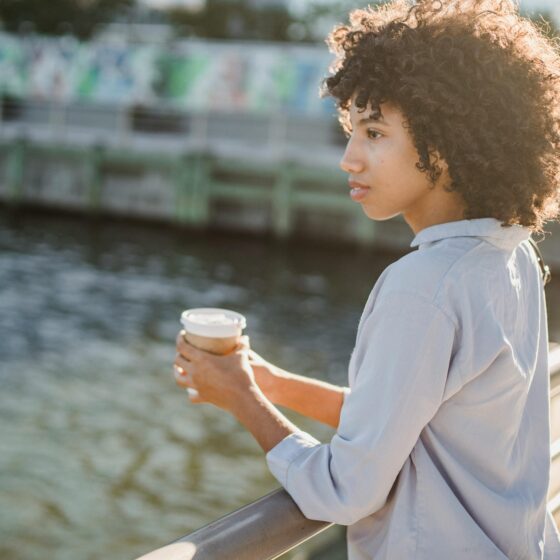 A confident woman walking outdoors, representing pretty privilege meaning and society’s beauty expectations